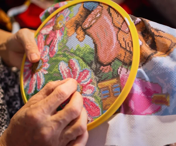 a-woman-embroiders-with-a-cross-wrinkled-hands-cl-2026-03-19-23-38-40-utc