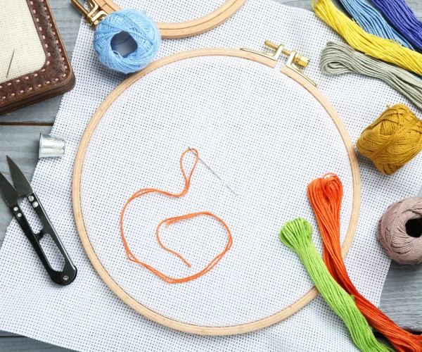 different-sewing-supplies-for-embroidery-on-grey-w-2026-03-27-00-44-47-utc