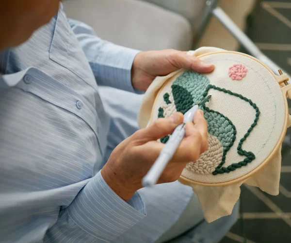 embroidering-detailed-artwork-on-fabric-in-natural-2026-01-09-11-05-35-utc