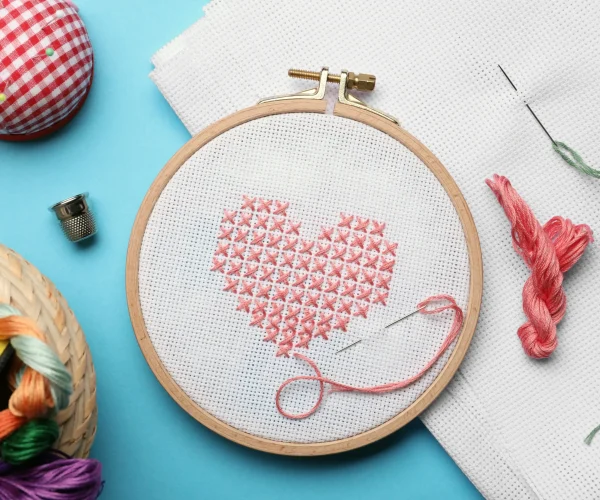 flat-lay-composition-with-embroidery-and-different-2026-03-27-00-48-34-utc