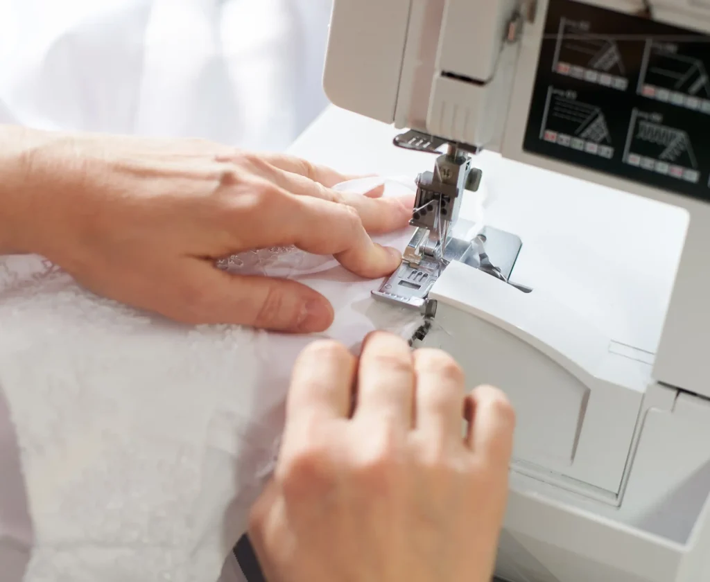 hands-at-stitching-and-repairing-process-with-whit-2026-03-17-01-41-42-utc