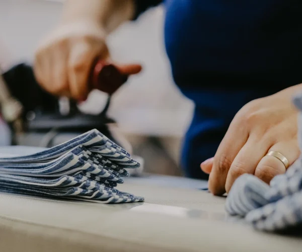selective-focus-shot-of-cloths-at-a-workshop-2026-03-18-05-42-07-utc